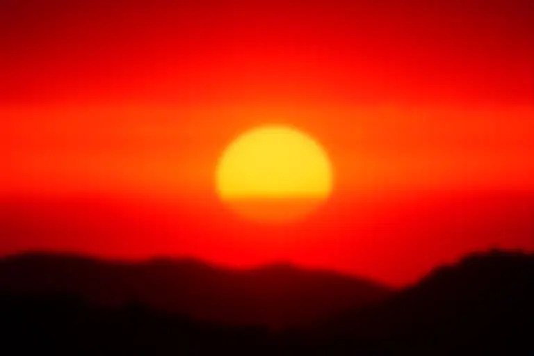 Vivid deep orange sunset stretching across the horizon