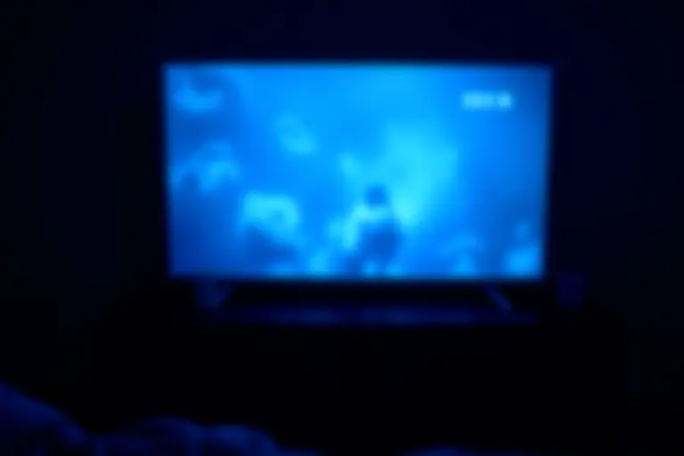 A TV screen showing a person's dream being broadcast with a live viewer count