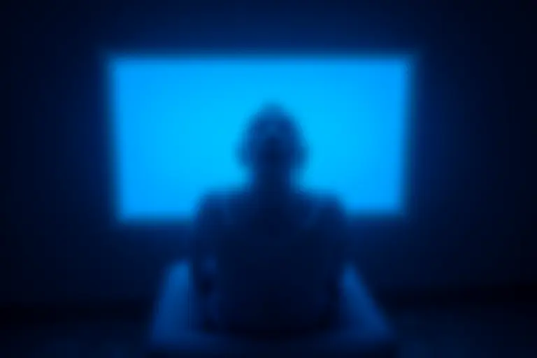 Person under an artificial UV light panel