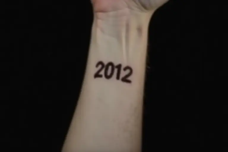 A wrist with a date stamped on it