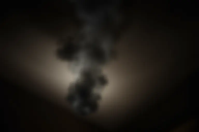 Smoke billowing from an oven in a domestic kitchen