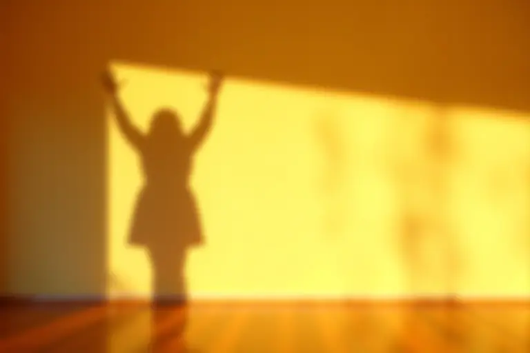 A person's shadow acting independently on a wall